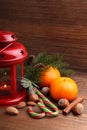 Christmas spirit: nuts, tangerines, Christmas tree, nuts, a flashlight Royalty Free Stock Photo