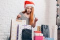 Christmas spirit, young attractive girl choosing a present for friends Royalty Free Stock Photo