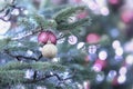 Christmas spurse tree with decorations, christmas balls, silver garlands, bokeh. Light festive background. Selective