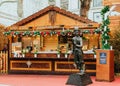 London, UK/Europe; 20/12/2019: Christmas stall next to the Charlie Chaplin statue at the Christmas market of Leicester Square,