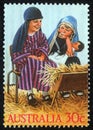 Christmas stamp printed in Australia shows children play to the Holy Family Royalty Free Stock Photo