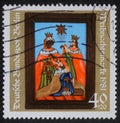 Christmas stamp printed in the Germany shows birth of Jesus Christ, adoration of the Magi