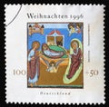 A Christmas stamp printed in Germany shows Birth of Jesus Christ, Illustration from Henry II`s `Book of Pericopes`