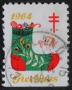 Christmas stamp printed in the USA shows a stocking with gifts