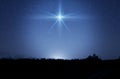 Christmas star. Background of the beautiful nite dark starry sky and bright star. Nativity of Bethlehem, Nativity of Jesus Christ