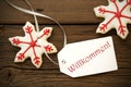 Christmas Star Cookies with Willkommen Label Royalty Free Stock Photo