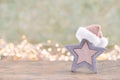 Christmas star, decor on bokeh colored background. Christmas or New Year minimal concept