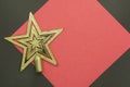 Christmas star on a red and black background with copy space for text Royalty Free Stock Photo