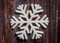 Christmas star snowflake decoration on age weathered wood wall texture