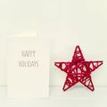 Christmas star and text happy holidays Royalty Free Stock Photo