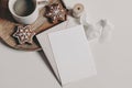 Christmas still life. Blank greeting card, invitation mockup. Star shaped gingerbread cookies, cup of coffee on wooden