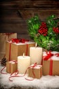 Christmas still life burning candles gift boxes and christmas tr Royalty Free Stock Photo