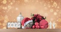 Christmas still life with calendar for year 2022 and home decoration gifts. Royalty Free Stock Photo