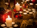 Christmas still life with candles of different size and shape, d Royalty Free Stock Photo