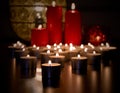 Many burning tealight candles stock images