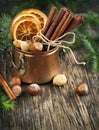 Christmas still life: cinnamon, nuts and fir branches