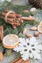 Christmas still life with delicious, almond, cinnamon, snowflakes on wooden table.