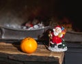 Christmas still life in fireplace. Christmas tree, tangerine, Sa Royalty Free Stock Photo