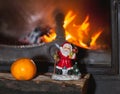 Christmas still life in fireplace. Christmas tree, tangerine, Sa Royalty Free Stock Photo