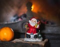Christmas still life in fireplace. Christmas tree, tangerine, Sa Royalty Free Stock Photo