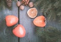 Christmas still life with persimmon and cinnamon with fir-tree on wooden background. Top view. Royalty Free Stock Photo