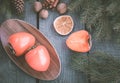 Christmas still life with persimmon and cinnamon with fir-tree on wooden background. Top view. Royalty Free Stock Photo