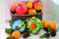 Christmas still life of fruit, balls and cones. Royalty Free Stock Photo