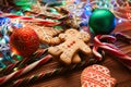 Christmas still life. homemade ginger biscuits, cane candy, on a wooden background. Royalty Free Stock Photo