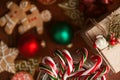 Christmas still life. homemade ginger biscuits, cane candy, on a wooden background. Royalty Free Stock Photo