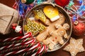 Christmas still life. homemade ginger biscuits, cane candy, on a wooden background. Royalty Free Stock Photo