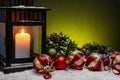 A christmas still life image with candle, snow and copy space