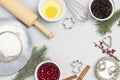 Christmas still life of items for baking cookies. Broken egg in bowl, whisk and sieve, molds, and flour on table Royalty Free Stock Photo