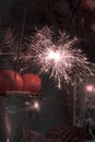 Christmas still life with tangerines and sparklers. Vintage tinting Royalty Free Stock Photo