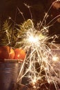 Christmas still life with tangerines and sparklers. Vintage tinting Royalty Free Stock Photo