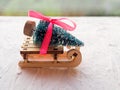 Christmas still life of a toy sled, Vintage photo, Gifts for Christmas on wooden sled, Merry Christmas tree transporter Royalty Free Stock Photo
