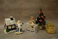 Christmas still life, toys Santa Claus and snow maiden violinist near the Christmas tree Royalty Free Stock Photo
