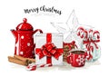 Christmas still-life, white gift box wit red ribbon, red tea pot, cookies, glass jar with candy canes, cinnamon sticks