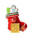 Christmas stocking with cookies, gifts and ball isolated Royalty Free Stock Photo