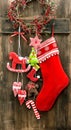 Christmas stocking and handmade toys hanging. Vintage decoration Royalty Free Stock Photo