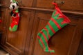 Christmas stocking hanging on a drawer with background