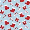 Christmas stocking seamless pattern with gifts and sweets