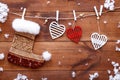 Christmas stocking, white red hearts hanging on brown wooden background, xmas valentines day card, copy space, top view Royalty Free Stock Photo