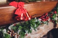 Christmas stockings hanging over a fireplace with candles on the mantlepiece. Royalty Free Stock Photo