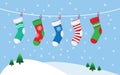 Christmas stockings for presents, hanging on a rope. Royalty Free Stock Photo