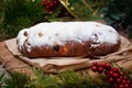 Christmas stollen its a Traditional Dresdner German Christmas cake Stollen with raising, berries and nuts. Christmas decorations