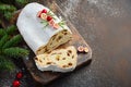 Christmas Stollen. Traditional German, European Festive Dessert. Holiday Concept Decorated with Fir Branches and Cranberries. Royalty Free Stock Photo