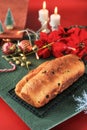 Christmas Stollen. Traditional Sweet Fruit Loaf German Bread with Icing Sugar. Xmas Holiday Table Setting, Decorated with Mini