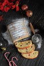 Christmas Stollen. Traditional Sweet Fruit Loaf with Icing Sugar. Xmas Holiday Table Setting, Decorated with Mini Tree Christmast