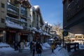 A Christmas Story in the Village of Whistler. Snowy buildings - on the roofs, ski resort. A cold but clear sunny winter day. Royalty Free Stock Photo