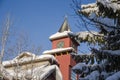 A Christmas Story in Whistler  village - Snow-covered buildings - on the roofs, Ski resort. A cold but clear sunny winter day. Royalty Free Stock Photo